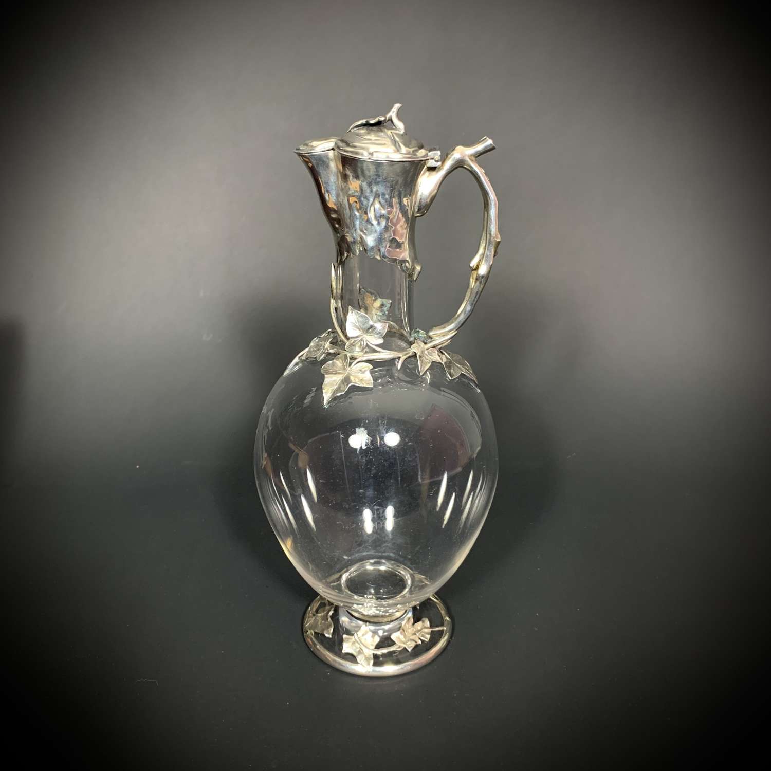 An Aesthetic movement Silver Mounted Claret Jug by EH Stockwell
