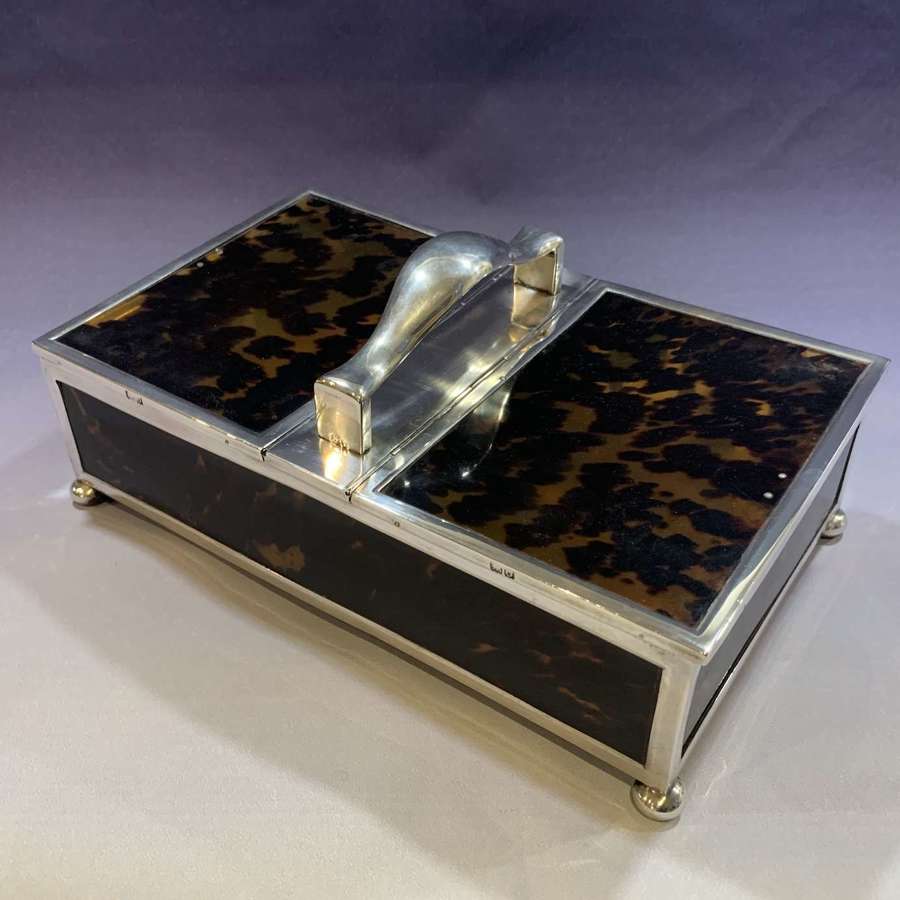 A large sterling silver and tortoiseshell two section cigar box