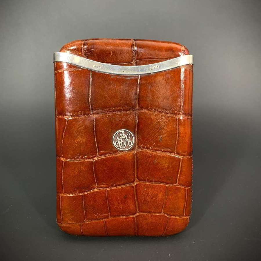 A very large silver mounted crocodile skin cigar wallet