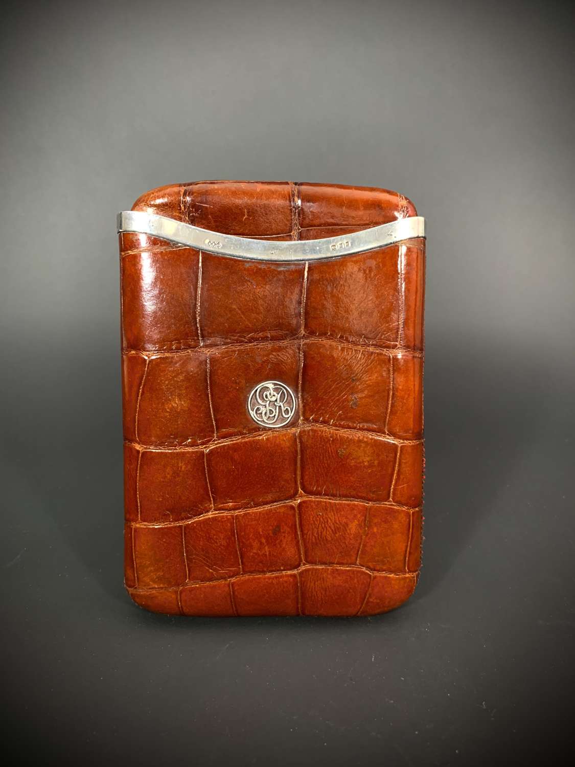 A very large silver mounted crocodile skin cigar wallet