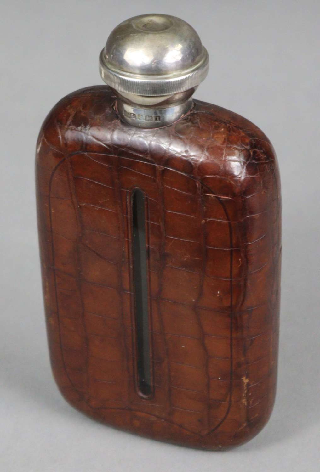 An unusual sterling silver and Crocodile skin hip flask