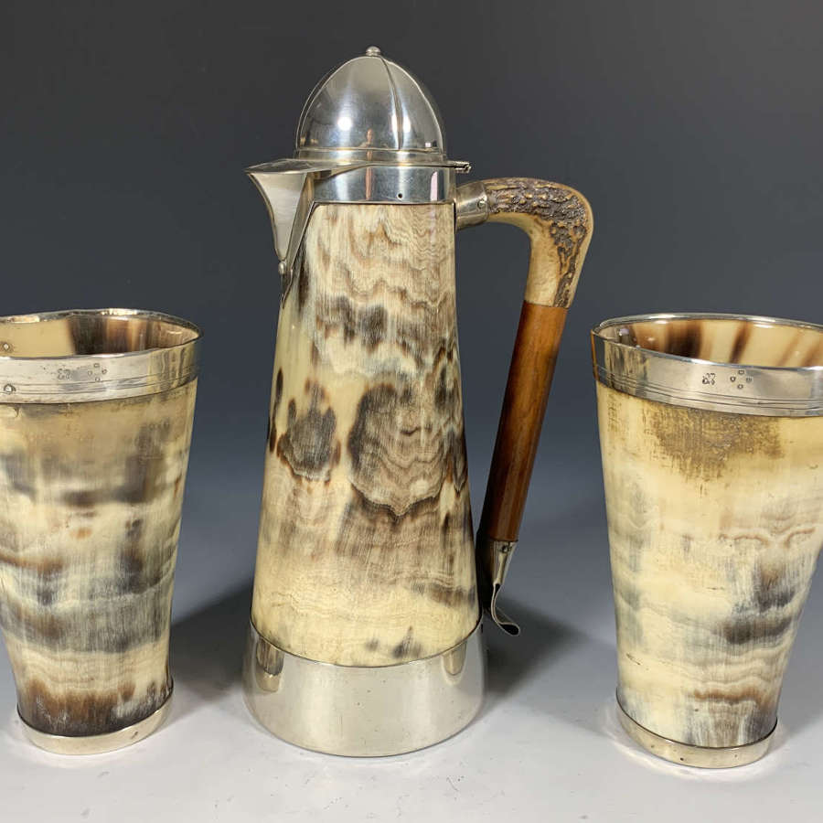 A Jockey themed horn tankard set with matching beakers