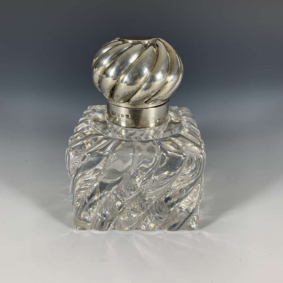 A Wrythen glass and silver inkwell
