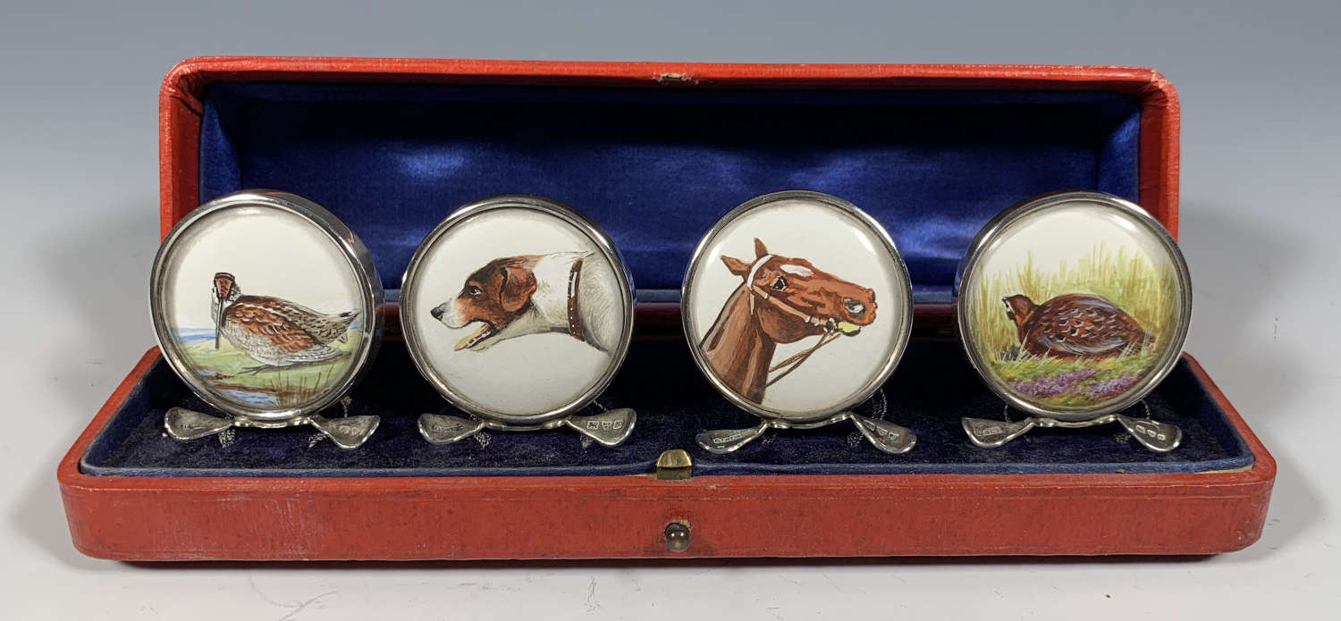 A cased set of four hunting themed menu holders.