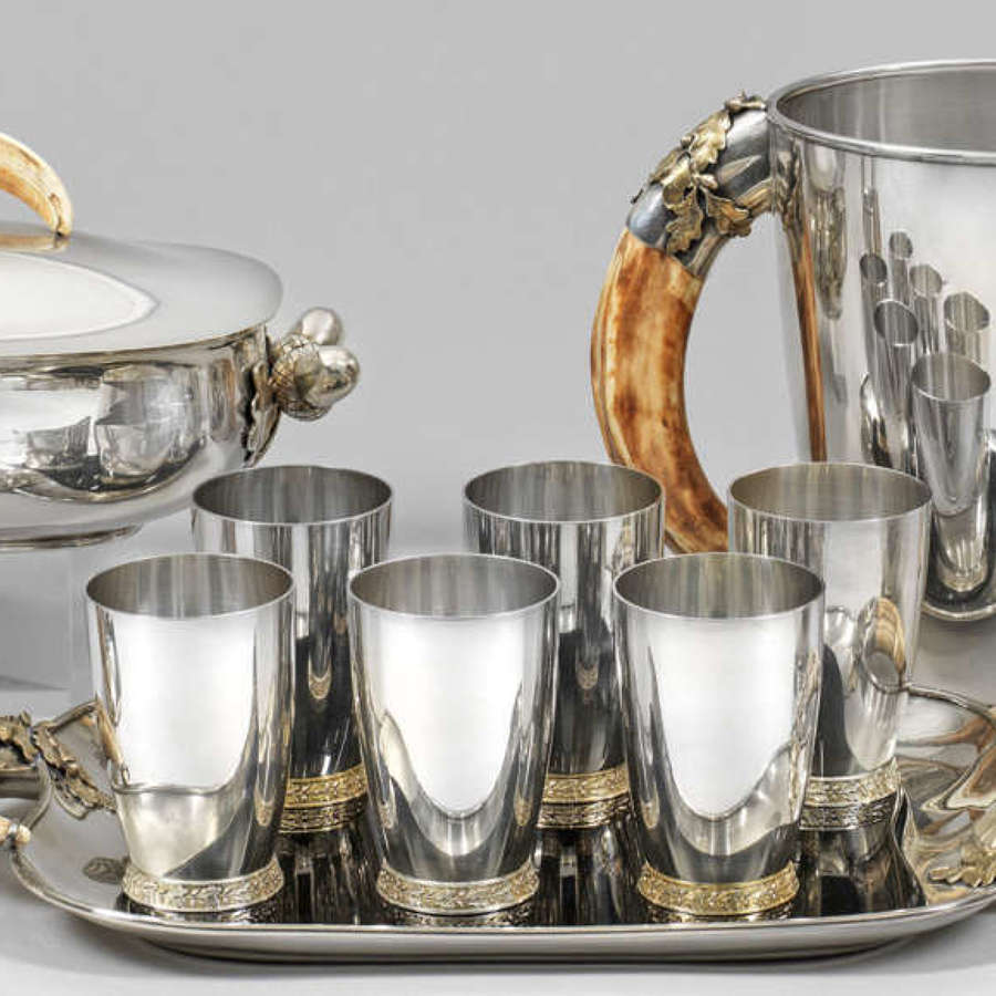 An impressive sterling silver drinking set