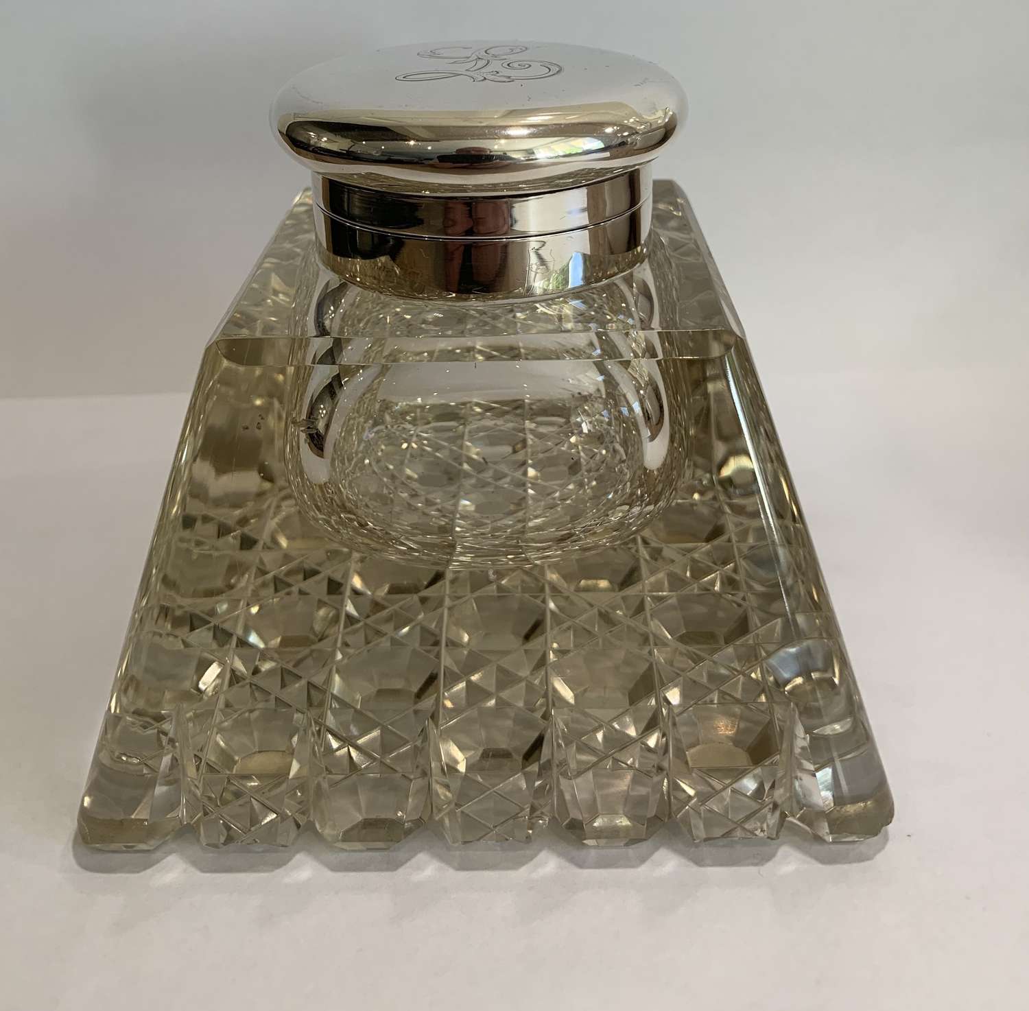 A pyramid style silver inkwell with hobnail cut glass
