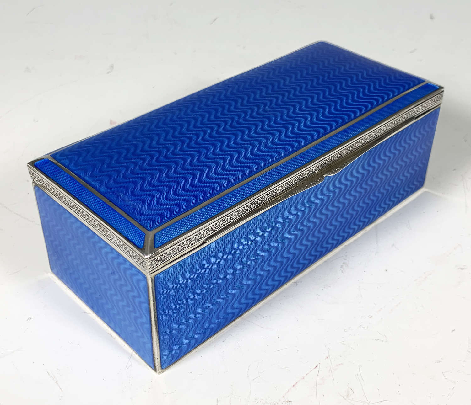 An exceptional Silver & Guilloche enamel cigar box