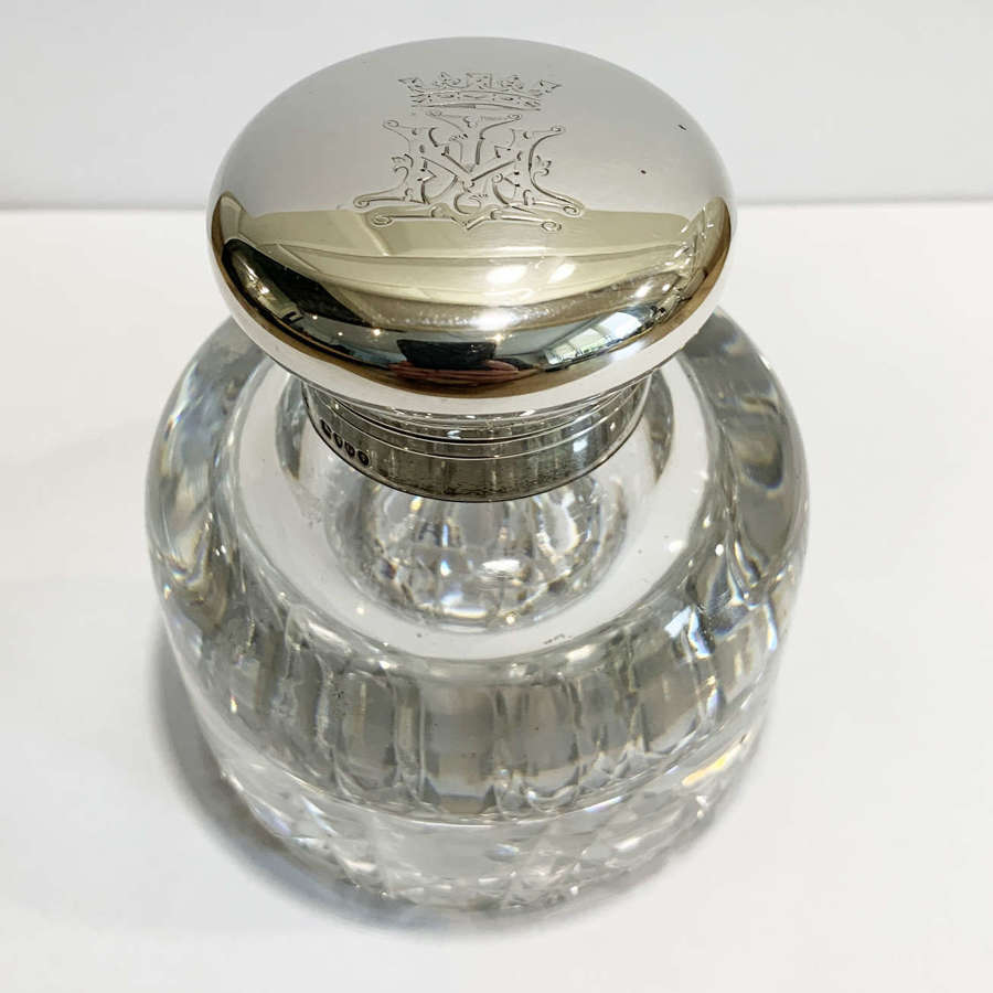 A silver and glass inkwell formerly owned by Princess Louise