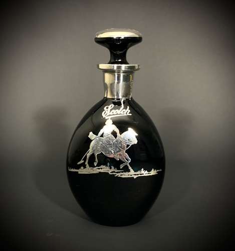 An obsidian glass & inlaid silver decanter depicting a Polo player