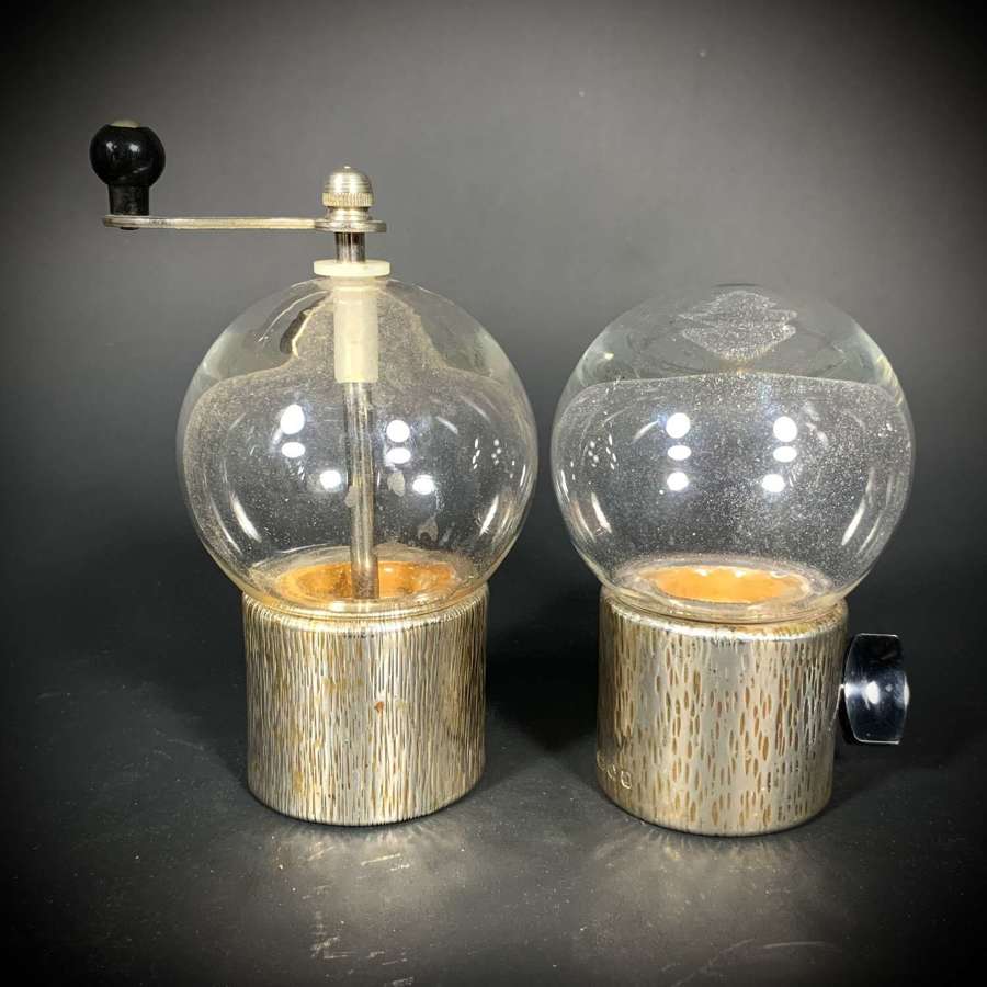 A modern pair of sterling silver bark effect salt and pepper grinders