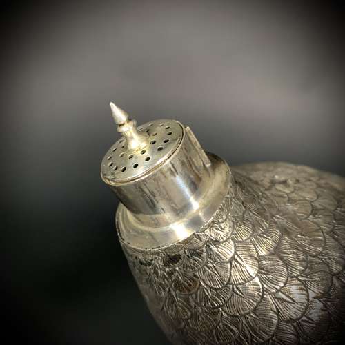 An Art Deco silver Pheasant sifter. Dutch, dated for 1920.