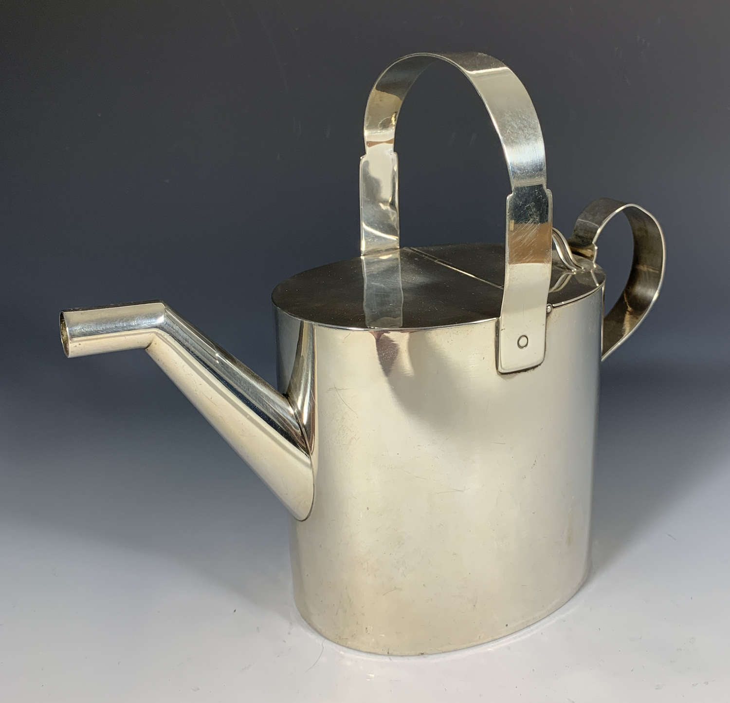 A silver watering can by Dr Christopher Dresser