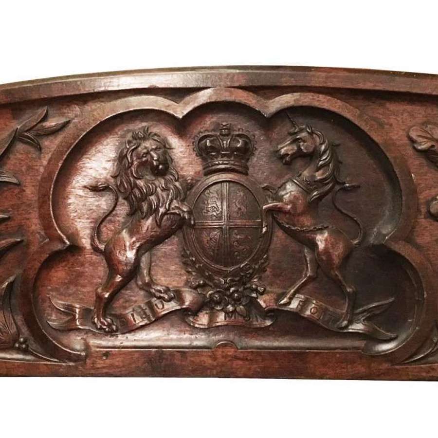 A hand carved wooden Royal Arms