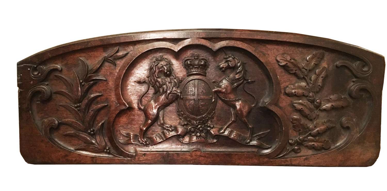 A hand carved wooden Royal Arms