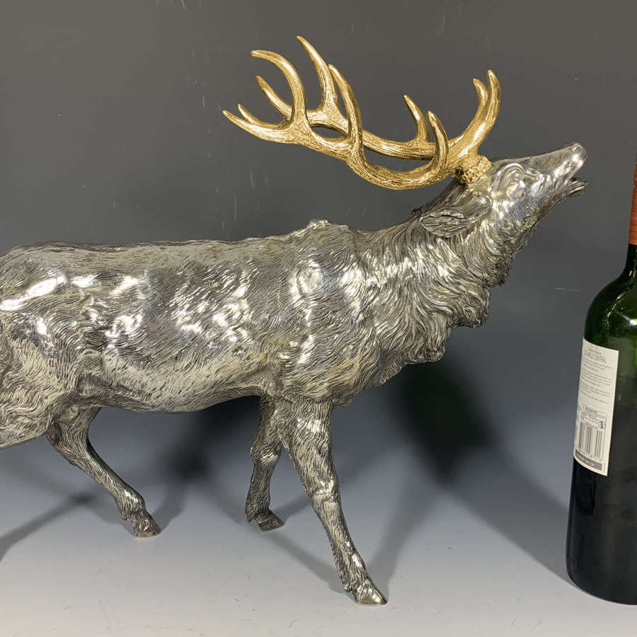 A very large sterling silver and silver gilt model of a rutting stag