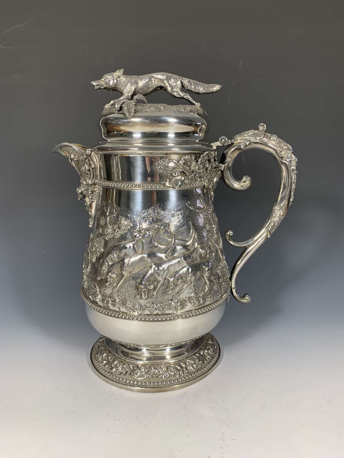 An exceptionally large hunting themed sterling silver tankard