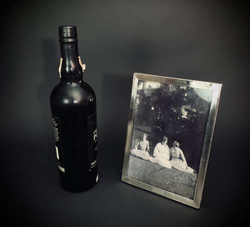 An Art Deco engine turned silver photograph frame dated 1922