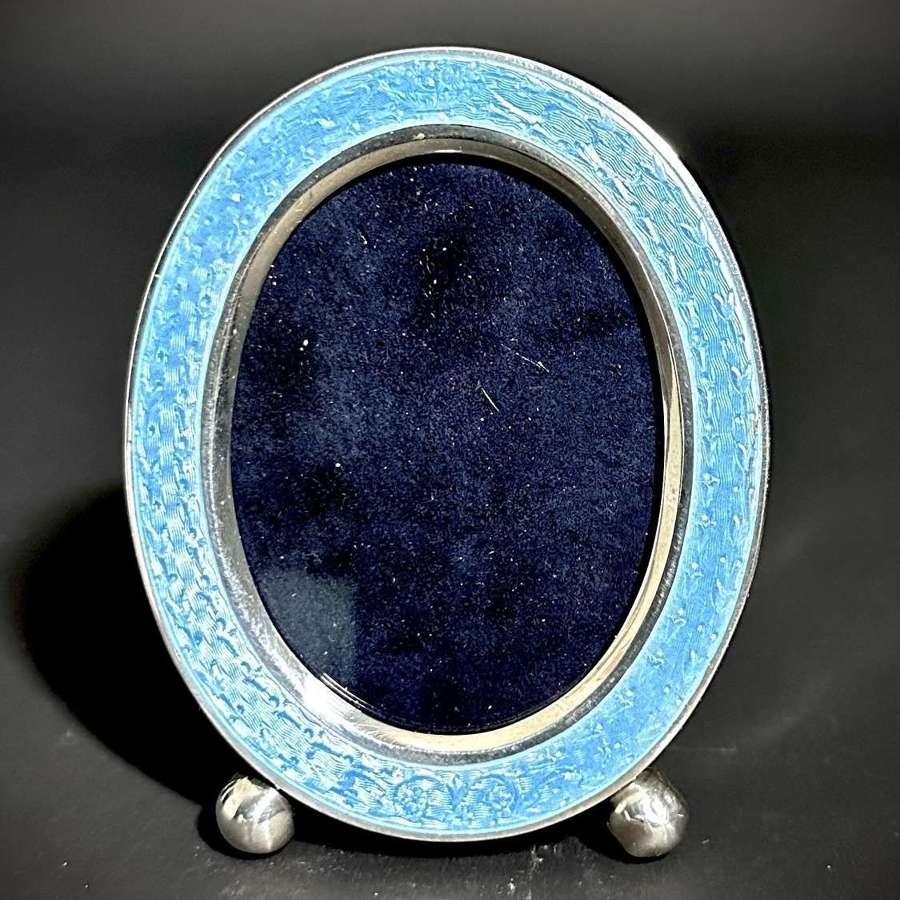 An American oval Sterling Silver & Guilloche enamel photograph frame.