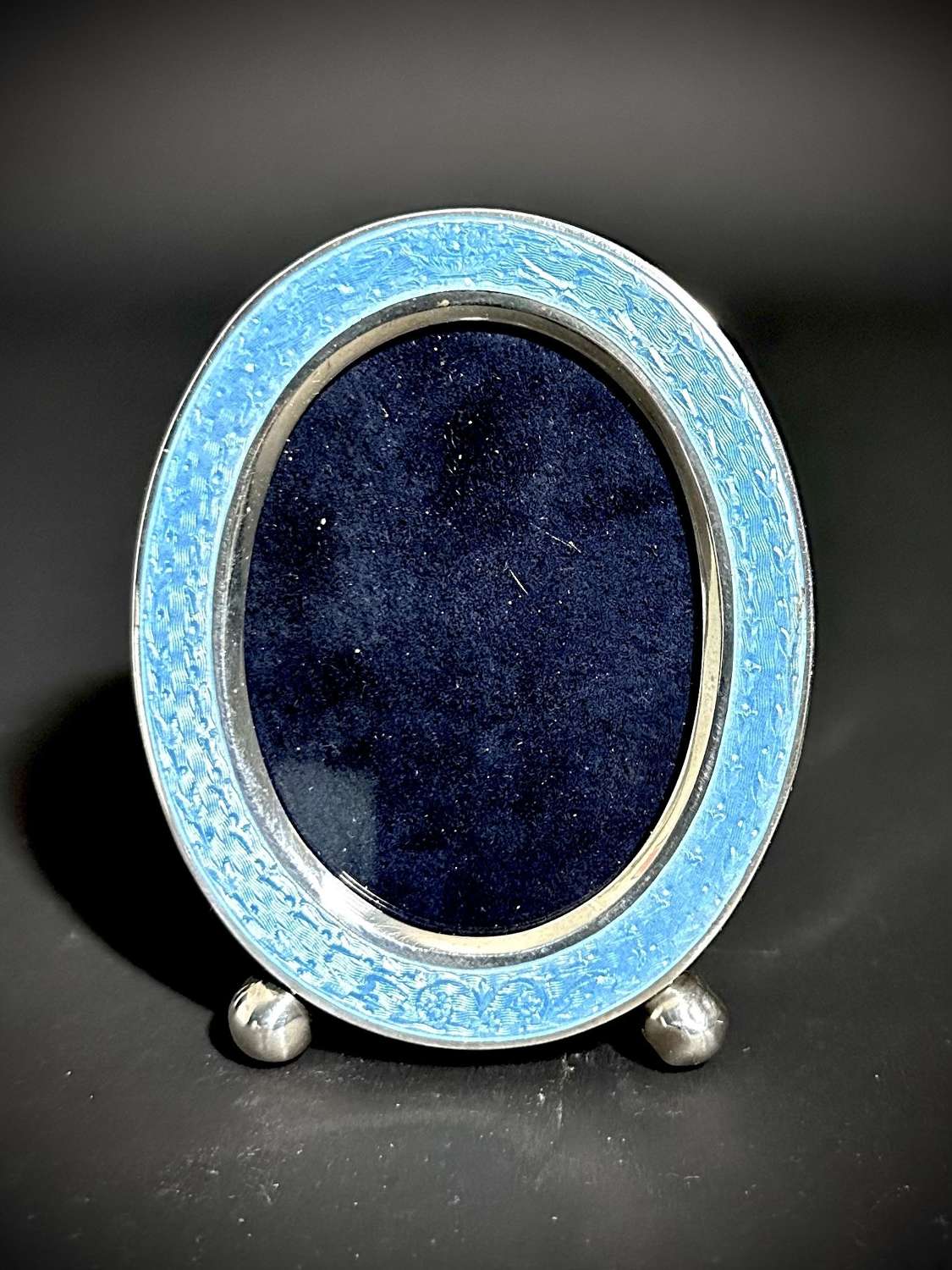 An American oval Sterling Silver & Guilloche enamel photograph frame.