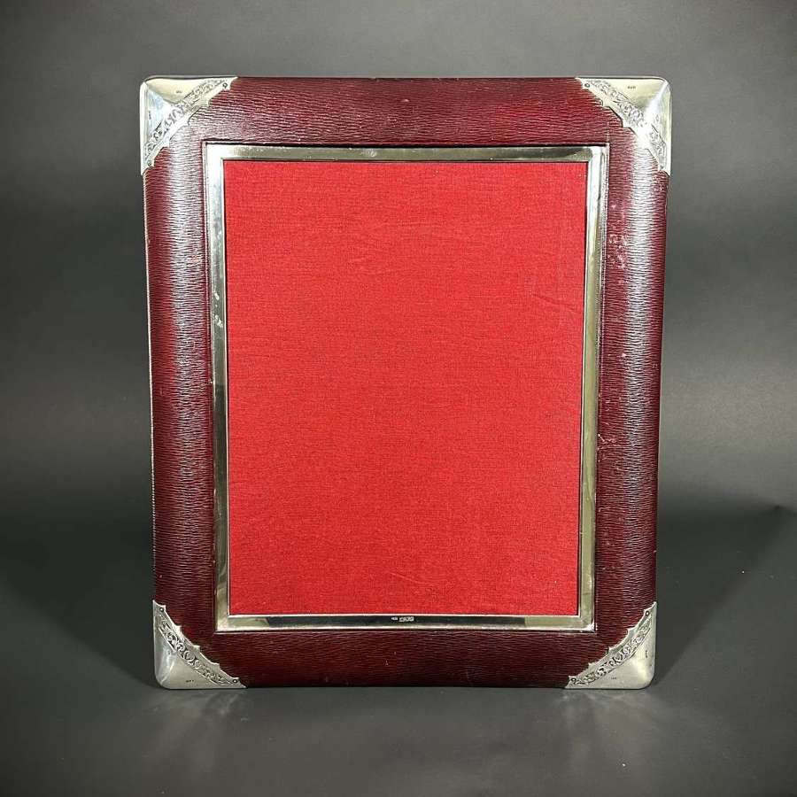 A very large silver and leather Victorian photograph frame