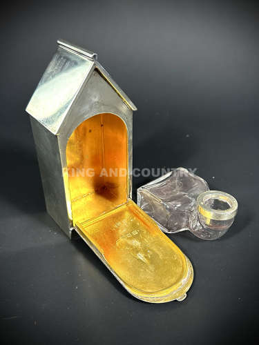A Edwardian inkwell fashioned as a Sentry Hut with Guard