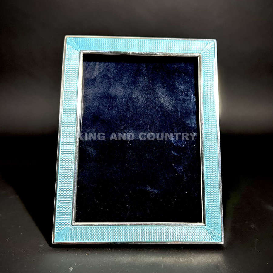 An unusual Art Deco American silver and enamel photograph frame
