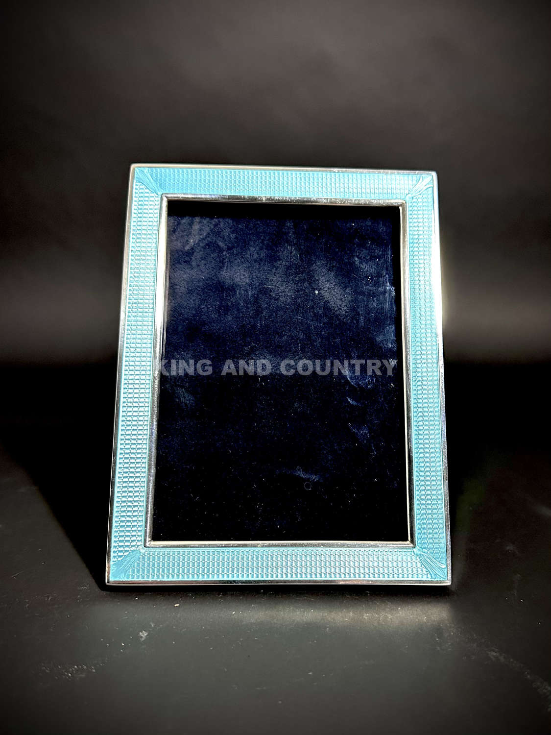 An unusual Art Deco American silver and enamel photograph frame