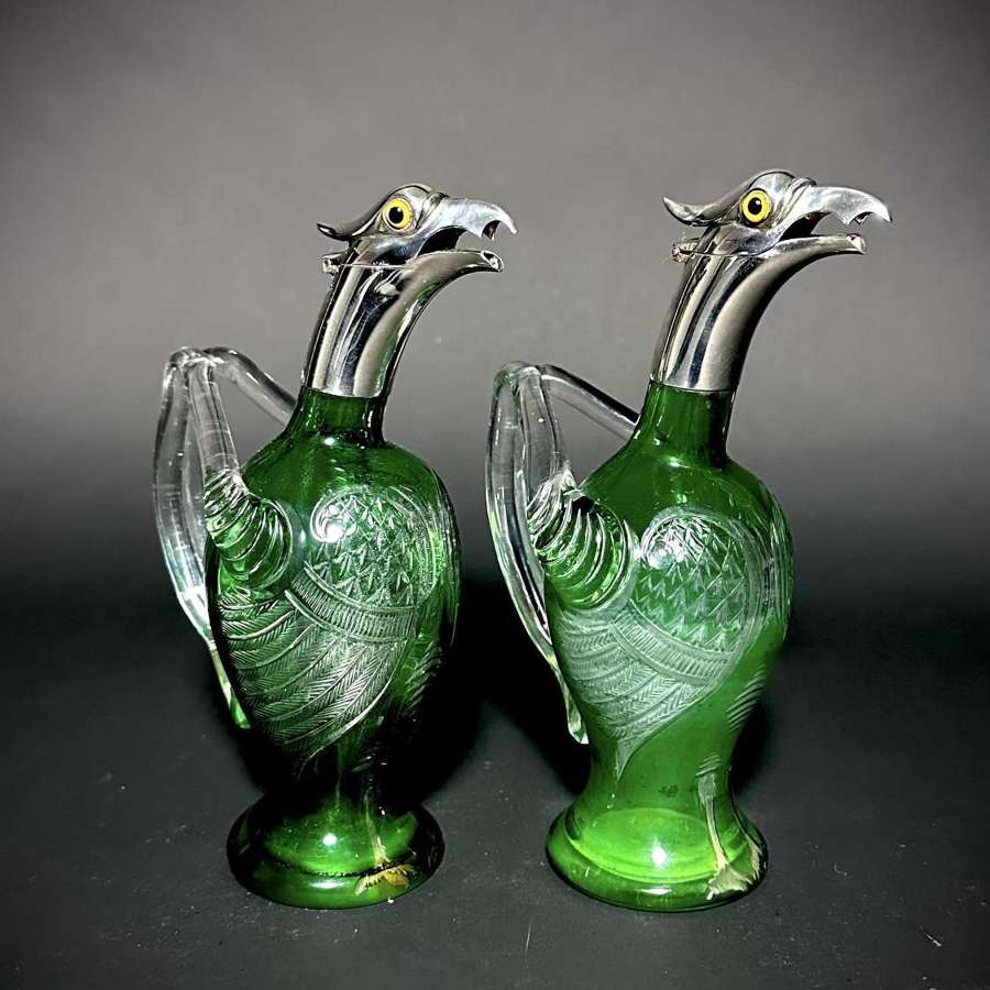 A rare pair of small Victorian Griffin Claret jugs