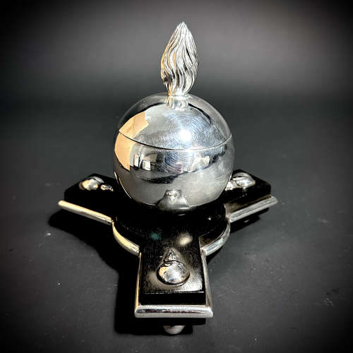 An unusual silver Grenade inkwell on an ebony base