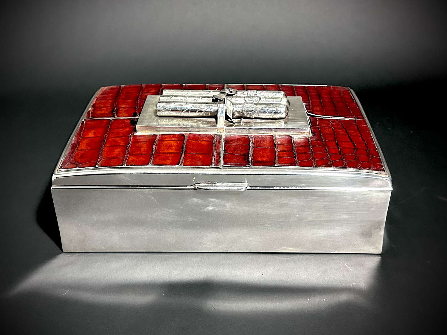 An Art Deco silver and crocodile skin cigar box