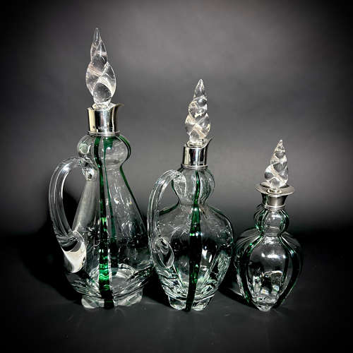 A set of 3 Art Nouveau Stuart Glass Claret jugs by Heath & Middleton