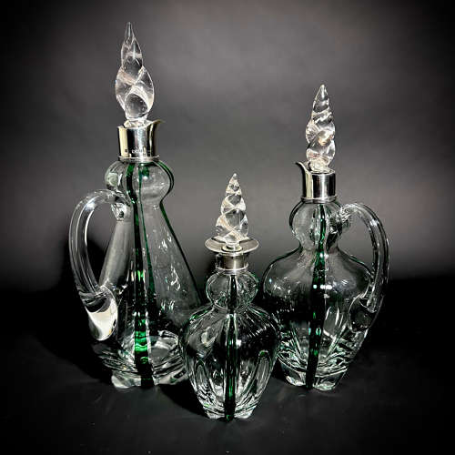 A set of 3 Art Nouveau Stuart Glass Claret jugs by Heath & Middleton