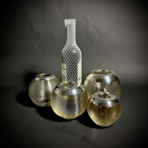 A selection of large silver and glass match strikers