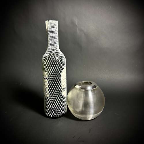 A selection of large silver and glass match strikers